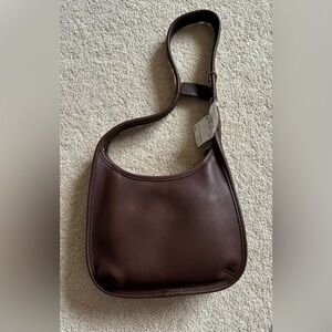 New ergo mini coach purse  7 inches tall 9 1/2 inches wide 2 inch base